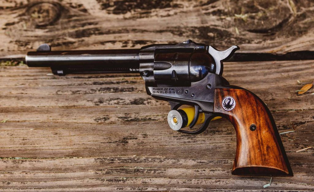 firearm on wooden desk at salvage content consulting